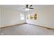 Bedroom with a ceiling fan, two windows, neutral walls, and gray carpet at 823 W 200 N, Greenfield, IN 46140