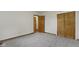 Neutral bedroom with gray carpet and natural wood doors and trim at 823 W 200 N, Greenfield, IN 46140