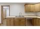 Kitchen features stainless steel dishwasher, double sink and oak cabinets at 823 W 200 N, Greenfield, IN 46140