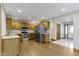 Open kitchen with stainless steel appliances, wood cabinets, and hardwood floors at 823 W 200 N, Greenfield, IN 46140