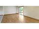 Open floor plan living room featuring hardwood floors and access to outdoor patio at 823 W 200 N, Greenfield, IN 46140