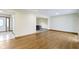 Open-concept living space with hardwood flooring, seamlessly connecting the kitchen and dining area at 823 W 200 N, Greenfield, IN 46140