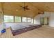 A sunroom features paneled ceiling, recessed lighting, fans, windows and a hot tub at 823 W 200 N, Greenfield, IN 46140