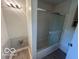 Clean bathroom with a shower over tub featuring sliding glass doors at 907 Monroe St, Indianapolis, IN 46229