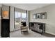 Bright Bedroom features a black crib, rocking chair, neutral walls, plush carpet, and large window with neighborhood views at 908 Norfolk Ln, Greenwood, IN 46143