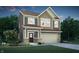 Beautiful two-story home featuring a two-car garage, a covered entryway, and manicured landscaping at 918 Norfolk Ln, Greenwood, IN 46143