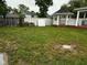 Spacious backyard featuring a charming gazebo, white fence, and lush greenery at 9527 Pepperidge Dr, Indianapolis, IN 46235