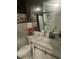 Bathroom vanity with a stylish white countertop, black hardware, and decorative wall art at 9527 Pepperidge Dr, Indianapolis, IN 46235