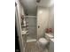 This is a bathroom with a walk-in shower featuring tiled walls and a toilet with pink flowers at 9527 Pepperidge Dr, Indianapolis, IN 46235