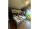 Unique bedroom featuring a twin-size house bed and playful decor at 9527 Pepperidge Dr, Indianapolis, IN 46235