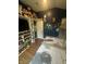 Bedroom featuring a themed house-style bed, toy shelving, and bright natural light at 9527 Pepperidge Dr, Indianapolis, IN 46235