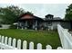 Inviting home with a cozy front porch and a lovely white picket fence at 9527 Pepperidge Dr, Indianapolis, IN 46235