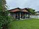 Charming home featuring a cozy front porch and well-maintained lawn at 9527 Pepperidge Dr, Indianapolis, IN 46235