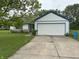 Charming home with a two-car garage, blue trim, and a well-maintained front yard at 9730 English Oak Pl, Indianapolis, IN 46235
