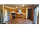 Functional kitchen with wooden cabinets, stainless steel appliances, and ample counter space at 9730 English Oak Pl, Indianapolis, IN 46235
