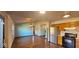 Bright and airy living room with hardwood floors and an open view to the kitchen at 9730 English Oak Pl, Indianapolis, IN 46235