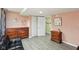 Finished basement with painted walls, grey flooring, wooden dressers, and closet access at 976 Santa Maria Dr, Greenwood, IN 46143