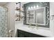 Charming bathroom with unique shelving, modern sink, and decorative wall accents at 976 Santa Maria Dr, Greenwood, IN 46143