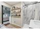 A bathroom with a modern stand up shower with marble paneling at 976 Santa Maria Dr, Greenwood, IN 46143