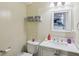A smaller bathroom with a sink, toilet, mirror and shelves at 976 Santa Maria Dr, Greenwood, IN 46143