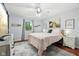 Cozy bedroom with hardwood floors, a ceiling fan, and soft, natural light at 976 Santa Maria Dr, Greenwood, IN 46143
