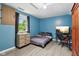 A bedroom with blue paneling, and gray floors at 976 Santa Maria Dr, Greenwood, IN 46143