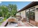 Outdoor wooden deck with barbecue grill, round table with chairs, and a backyard view at 976 Santa Maria Dr, Greenwood, IN 46143