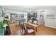 Open-concept dining area connects to a kitchen island and features stylish wood flooring at 976 Santa Maria Dr, Greenwood, IN 46143