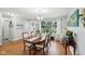 Inviting dining area with a traditional table, wood floors, and a view of the outdoors at 976 Santa Maria Dr, Greenwood, IN 46143