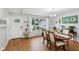 Light-filled dining area featuring a large window, wood floors, and charming decor at 976 Santa Maria Dr, Greenwood, IN 46143