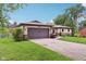 Single-story home featuring an attached garage, landscaped front yard, and charming curb appeal at 976 Santa Maria Dr, Greenwood, IN 46143