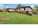 Single-story home with a spacious lawn, brick accents, and a cozy front porch area at 976 Santa Maria Dr, Greenwood, IN 46143