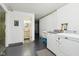 White painted laundry room featuring a modern washer and dryer and access to bathroom at 976 Santa Maria Dr, Greenwood, IN 46143