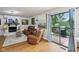 Cozy living room features a fireplace, leather seating, and access to an outdoor deck at 976 Santa Maria Dr, Greenwood, IN 46143