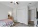 Bright bedroom with ceiling fan, closet, and light colored, wood-look floors at 9771 Blue Violet Dr, Noblesville, IN 46060
