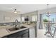 Well-equipped kitchen featuring modern appliances and a view of the living area at 9771 Blue Violet Dr, Noblesville, IN 46060