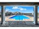 View of a clean community pool surrounded by lounge chairs at 9771 Blue Violet Dr, Noblesville, IN 46060