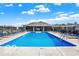 Beautiful community pool with lounge chairs, perfect for relaxing on a sunny day at 9771 Blue Violet Dr, Noblesville, IN 46060