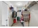 Organized walk-in closet features shelving and hanging storage, providing ample space for clothes and accessories at 9771 Blue Violet Dr, Noblesville, IN 46060