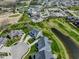 Aerial view showcasing the community's clubhouse, golf course, and surrounding homes at 987 Oak Terrace Rd, Westfield, IN 46074