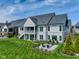 Expansive backyard with patio, firepit, and covered porch, perfect for entertaining at 987 Oak Terrace Rd, Westfield, IN 46074