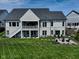 Spacious backyard with a patio, firepit, and lush green lawn at 987 Oak Terrace Rd, Westfield, IN 46074