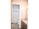 Bright bathroom featuring a granite vanity and a white tiled shower, providing a clean and functional space at 987 Oak Terrace Rd, Westfield, IN 46074