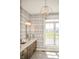 Well-lit bathroom features a sleek vanity, a large window with a view, and modern fixtures at 987 Oak Terrace Rd, Westfield, IN 46074