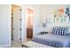 Cozy bedroom featuring a decorative shelf, stylish bedding, and an ensuite bathroom, creating a comfortable and inviting space at 987 Oak Terrace Rd, Westfield, IN 46074