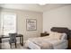 Comfortable bedroom with decorative art, desk, and soft, neutral color scheme at 987 Oak Terrace Rd, Westfield, IN 46074