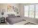 Serene bedroom showcasing neutral decor, a plush bed with a window view, perfect for relaxation and peaceful nights at 987 Oak Terrace Rd, Westfield, IN 46074