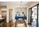 The dining room features a modern light fixture, sideboard, and access to an outdoor patio at 987 Oak Terrace Rd, Westfield, IN 46074