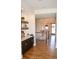 A hallway features a bar area, a staircase, and a view into the living and dining rooms at 987 Oak Terrace Rd, Westfield, IN 46074