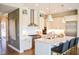 Modern kitchen with stainless steel appliances, white cabinets, and a large center island at 987 Oak Terrace Rd, Westfield, IN 46074